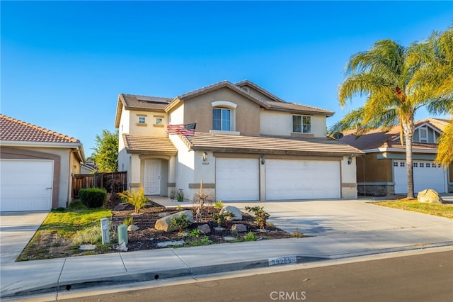 front of property with solar panels and a garage