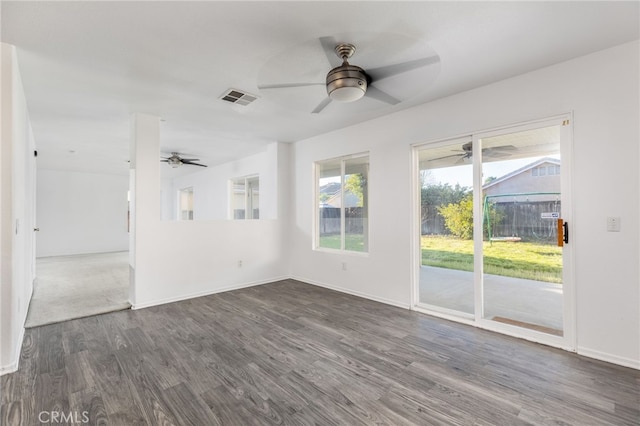 unfurnished room with dark hardwood / wood-style flooring