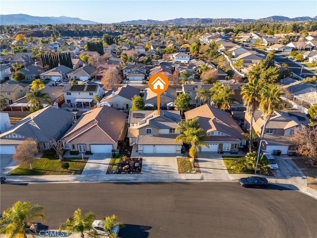 birds eye view of property featuring a mountain view