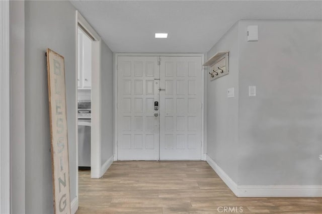 foyer with light hardwood / wood-style floors