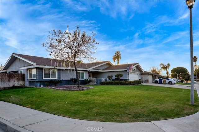 ranch-style home featuring a front lawn and a garage