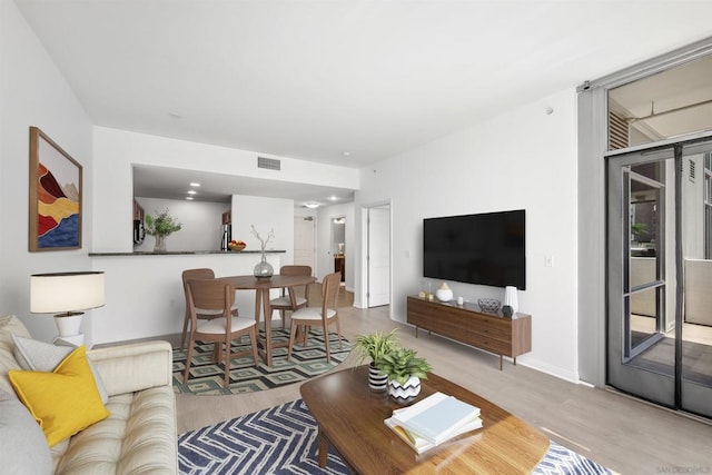 living room with light hardwood / wood-style floors