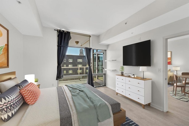 bedroom with light hardwood / wood-style flooring