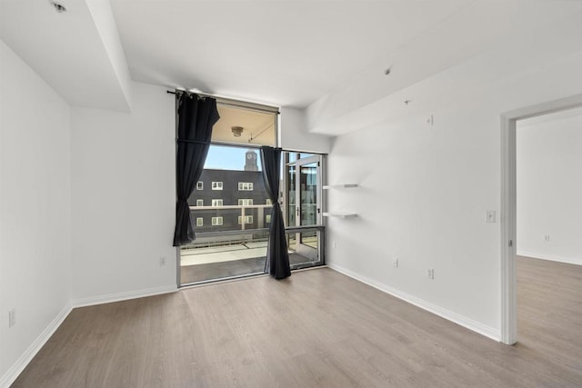 empty room featuring hardwood / wood-style floors