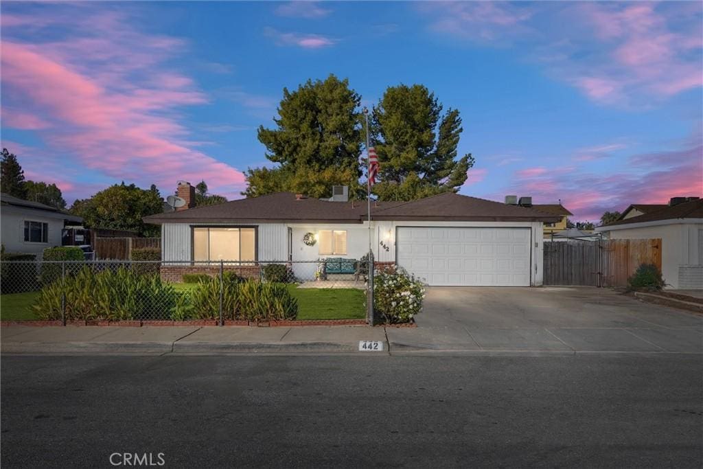 view of front of property with a garage