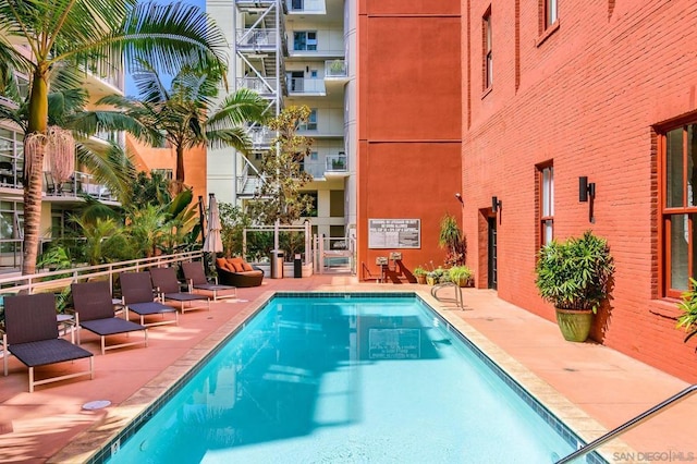 view of swimming pool featuring a patio area