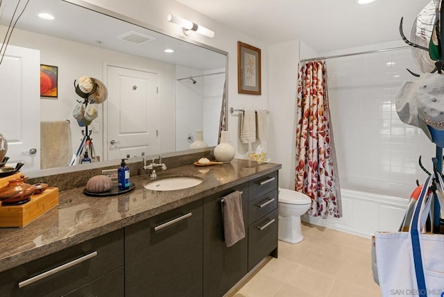 full bathroom featuring tile patterned floors, shower / tub combo with curtain, vanity, and toilet