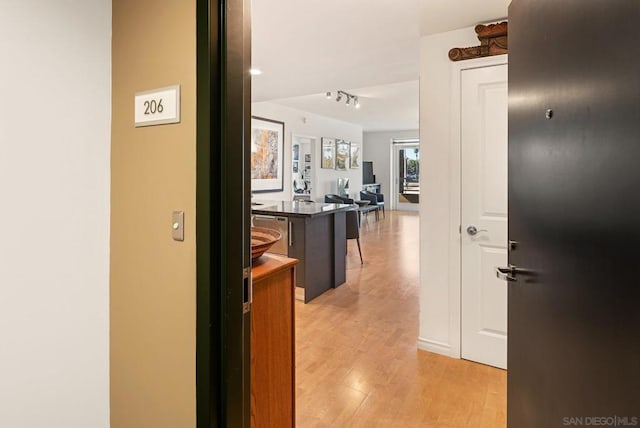 hallway with light wood-type flooring