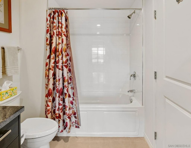 bathroom featuring shower / bathtub combination with curtain, tile patterned floors, and vanity