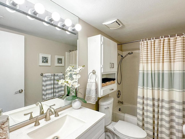 full bathroom featuring toilet, vanity, a textured ceiling, and shower / bathtub combination with curtain