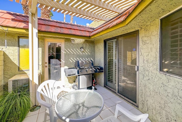 view of patio / terrace with a pergola and area for grilling