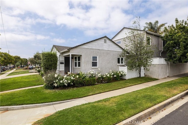 view of property exterior featuring a lawn