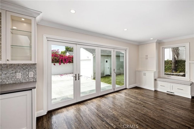 entryway with french doors, dark hardwood / wood-style flooring, and a healthy amount of sunlight