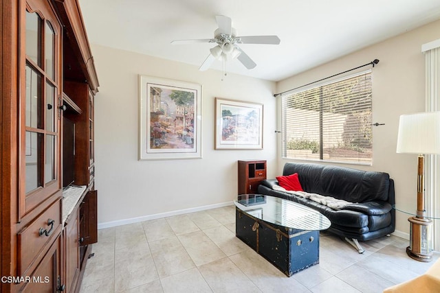 tiled living room featuring ceiling fan