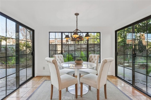 sunroom featuring a notable chandelier