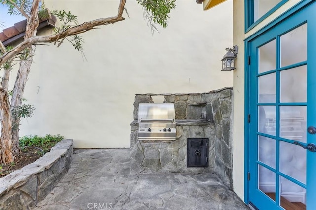 view of patio / terrace featuring exterior kitchen and area for grilling