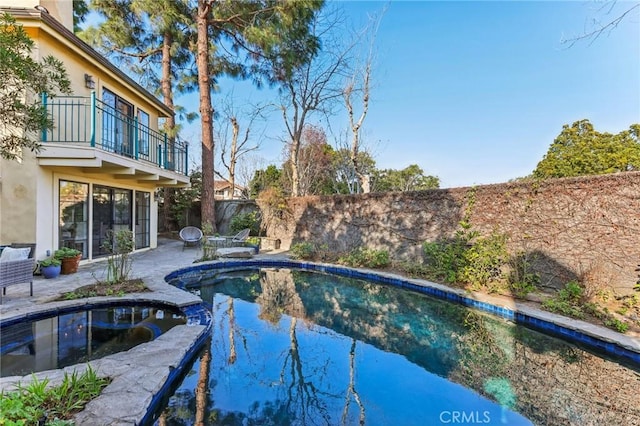 view of swimming pool with a patio