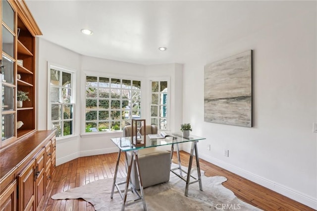 office with light hardwood / wood-style floors