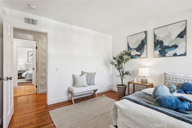 bedroom with hardwood / wood-style flooring