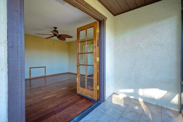 exterior space featuring ceiling fan