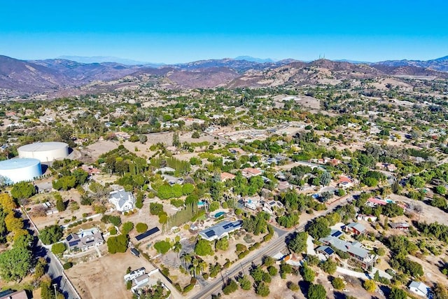 birds eye view of property with a mountain view