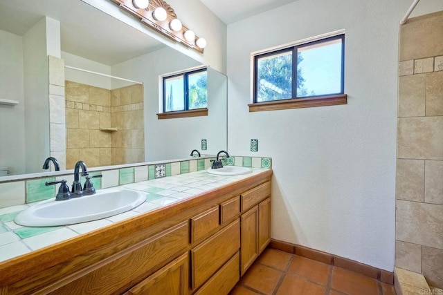 bathroom with vanity and tile patterned floors