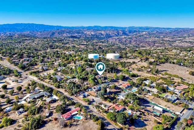 birds eye view of property featuring a mountain view