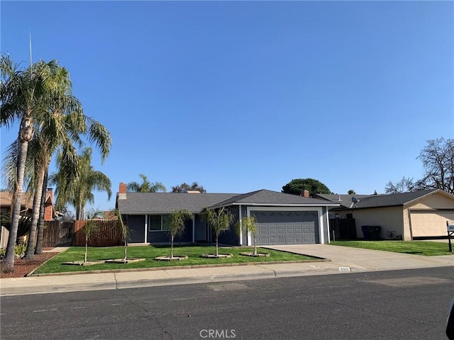 single story home with a front yard and a garage