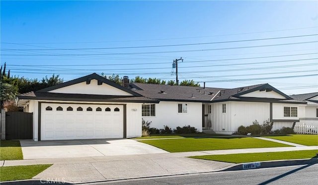 ranch-style house with a front lawn and a garage