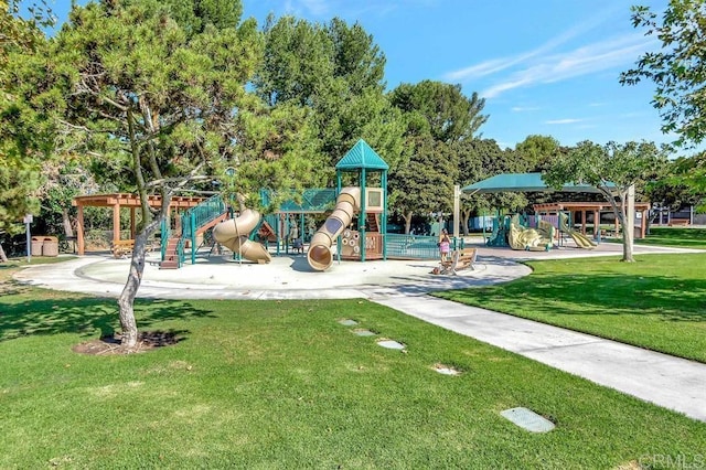 community jungle gym featuring a lawn