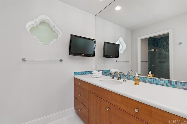 bathroom featuring marble finish floor, baseboards, recessed lighting, and vanity