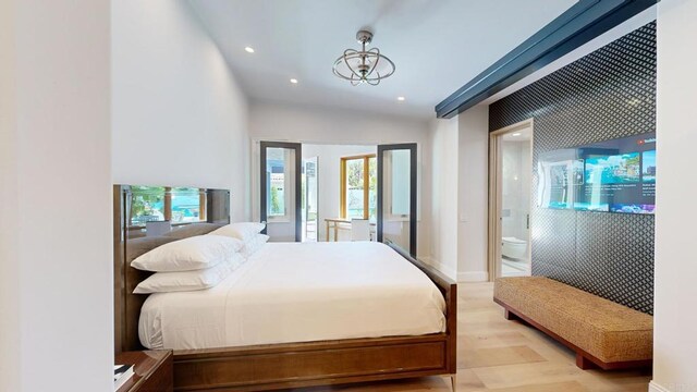bedroom featuring light wood-style floors, baseboards, and recessed lighting