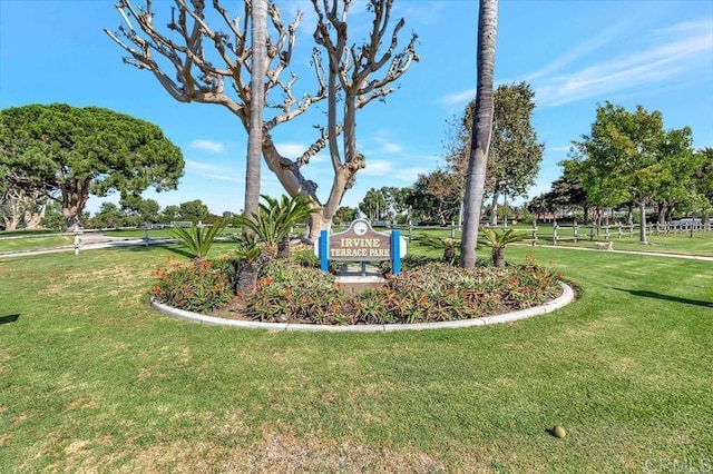 community sign featuring a lawn