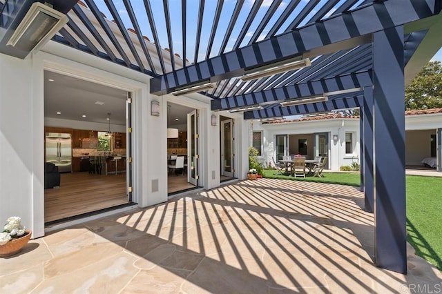view of patio / terrace featuring a pergola and outdoor dining area