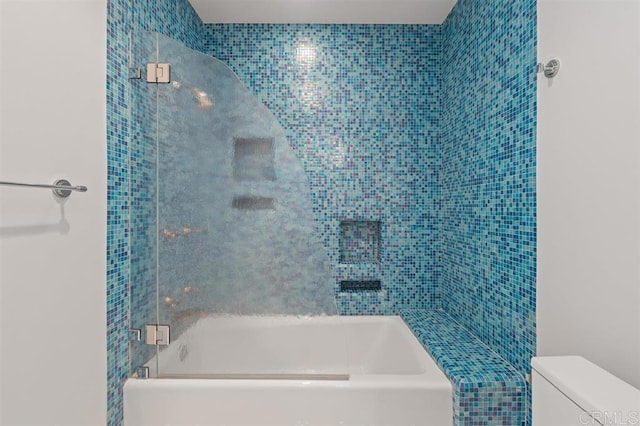 bathroom with toilet and shower / bathing tub combination