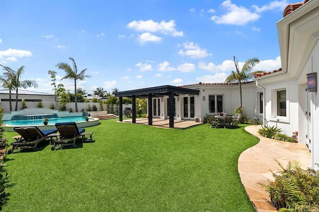 view of yard with a patio area, french doors, and a fenced in pool