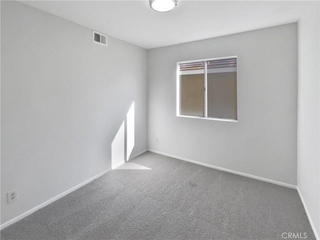 unfurnished room featuring carpet flooring