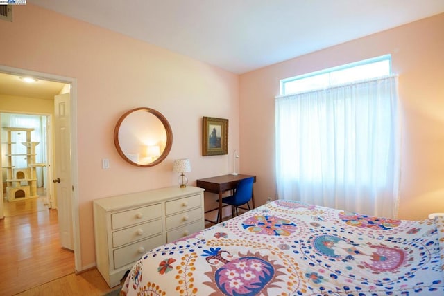 bedroom with light hardwood / wood-style flooring