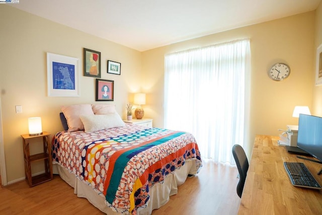 bedroom featuring wood-type flooring