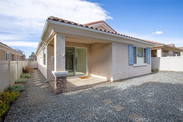 1634 Scottsdale Rd, Beaumont, CA 92223 - rear view of house featuring stucco siding, a patio, and a fenced backyard