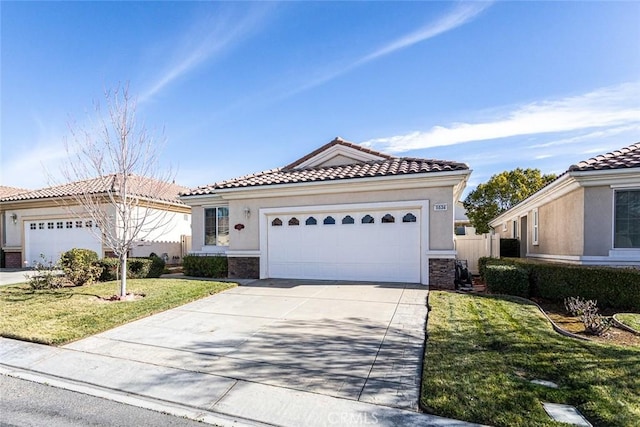 1634 Scottsdale Rd, Beaumont, CA 92223 - mediterranean / spanish home featuring a tile roof, a front yard, stucco siding, and concrete driveway