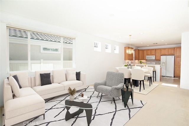 1634 Scottsdale Rd, Beaumont, CA 92223 - living room with a chandelier, recessed lighting, and light colored carpet