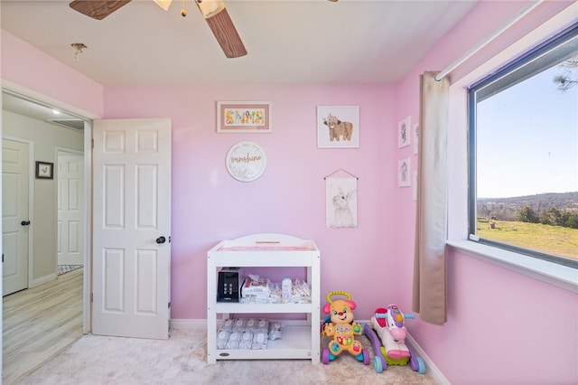 recreation room with light colored carpet and a healthy amount of sunlight