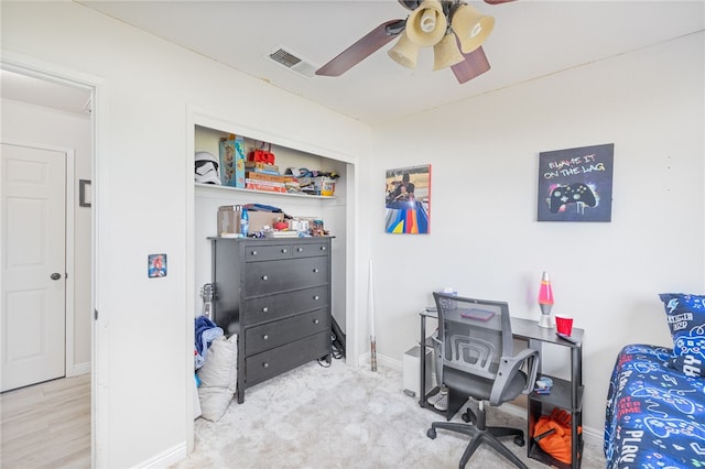 office with ceiling fan and light colored carpet