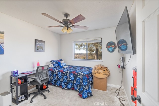 bedroom featuring ceiling fan and light colored carpet