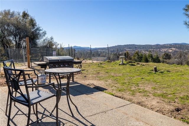 view of patio / terrace featuring area for grilling and a mountain view