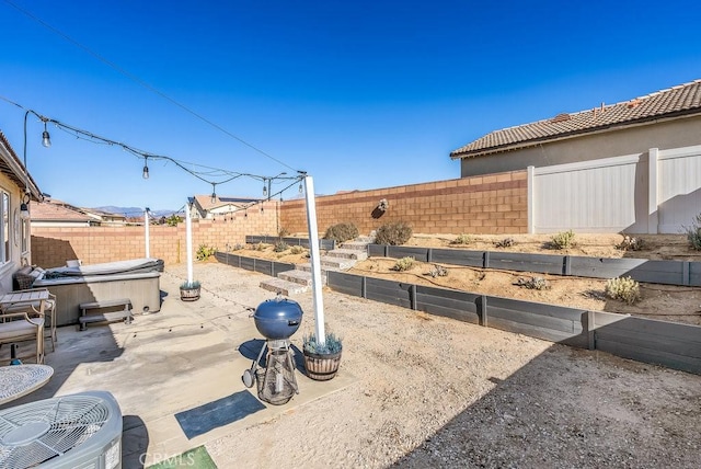 view of patio with a hot tub