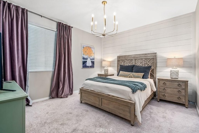 bedroom with wooden walls, light carpet, and a notable chandelier