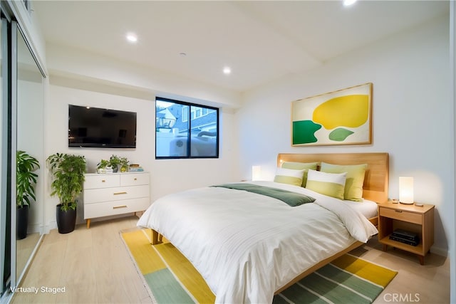 bedroom featuring light hardwood / wood-style floors