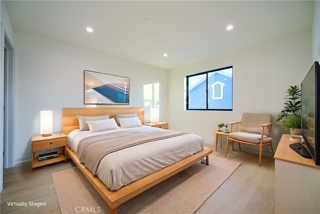 bedroom with light wood-type flooring